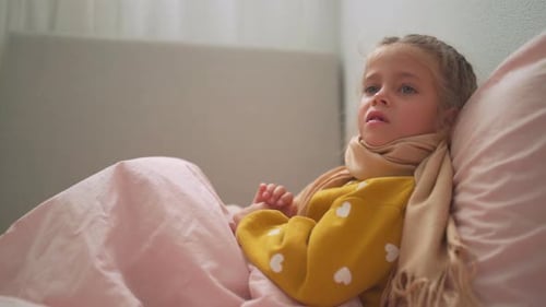 Sick Child Lying in Bed Resting