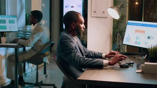 Company Personnel Sitting at Office Desk
