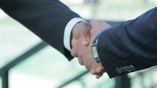Business Handshake Deal in the City