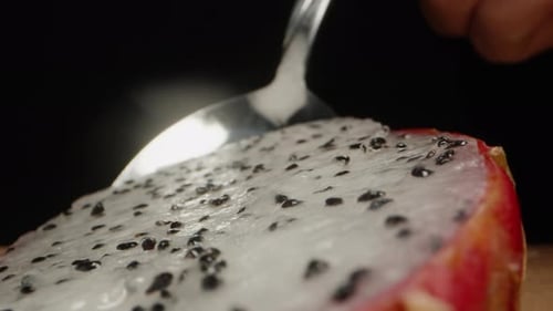 Spoon Cuts Into Delicious Pink Dragon Fruit