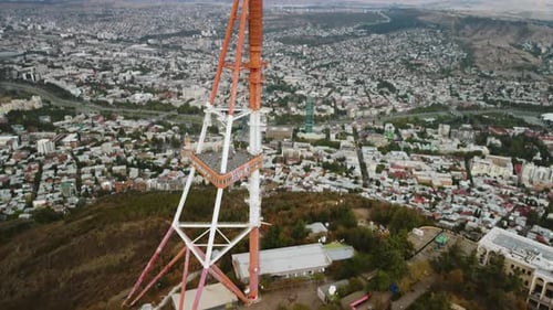 Drone Captures a Stunning Aerial View of a TV Broadcasting Tower Gracefully Standing Tall