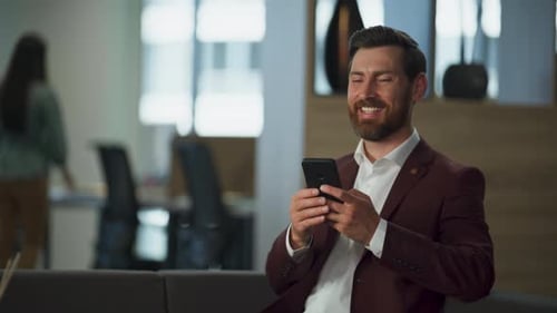 Smiling Professional Using Mobile Phone in Modern Office Closeup Happy Worker