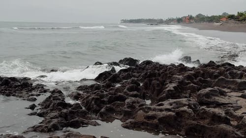 Ocean Waves Crashing Against the Black Reef Black Sand Beach