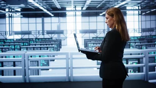 IT Specialist in Server Hub Monitoring Server Infrastructure Using Notebook