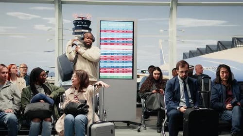 Frustrated Tourists Watching Cancelled Flights on Airport Screen