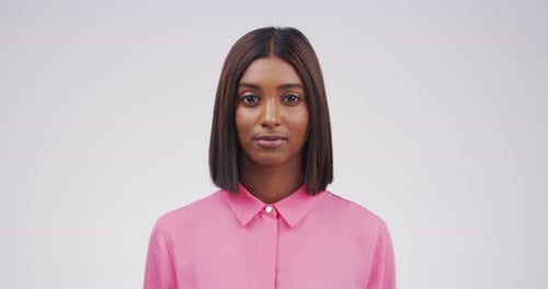 Woman Smiling in Front of a White Background
