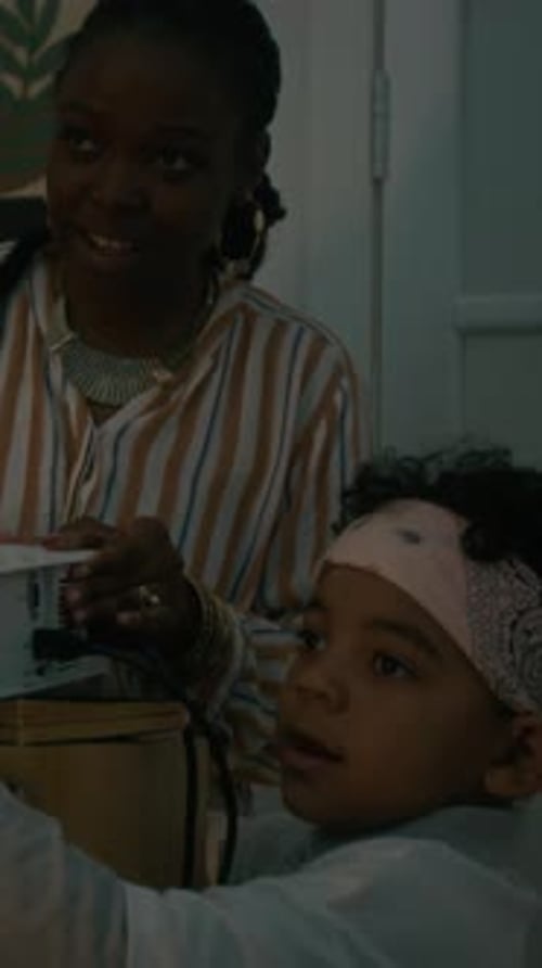 Black Mother and Kid Setting Projector for Home Cinema