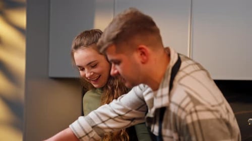 Close Up Young Couple in Love in a Beautiful Kitchen Preparing Dinner Together Happy Relationship