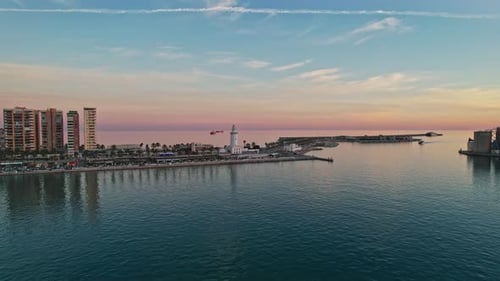 Malaga cityscape across the harbor at nightfall