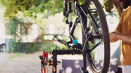 Caucasian Man Repairing Modern Bicycle