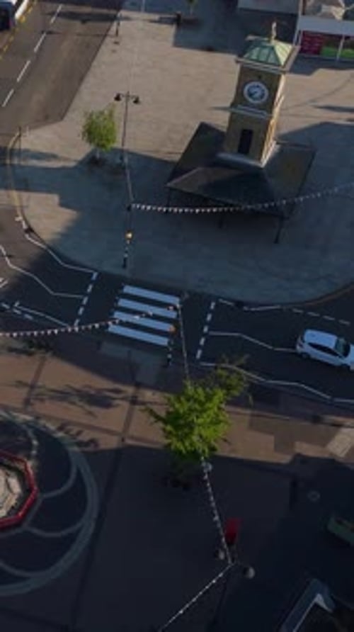 Vertical High Drone Orbit of Clock Tower and War Memorial in Hoddesdon, Hertfordshire, UK