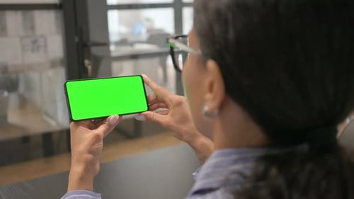 African Woman Holding Phone with Green Screen