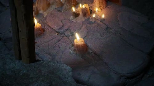 Candlelight Illuminates Mysterious Cave, Creating Warm, Inviting Ambiance