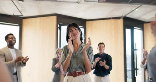 Business People Clapping at Meeting in Modern Office