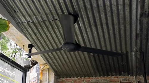 Ceiling Fan Spinning Below a Metal Roof