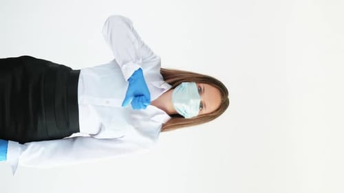 Woman in Mask Gives Thumbs Down Gesture