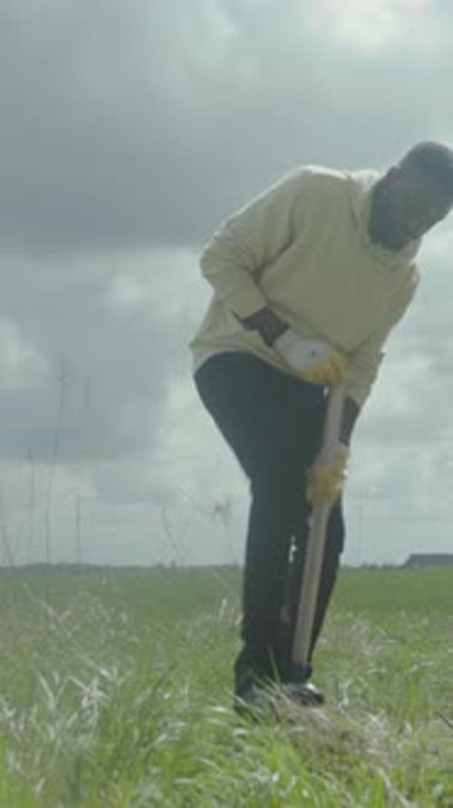 Laborer Working Outdoors Diligently Worker Diligently Tending to Earth for Environmental Growth and