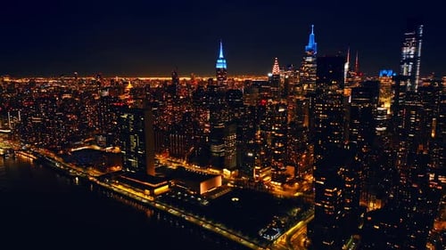 Breath-taking scenery of night New York, the USA. Dazzling illumination of metropolis
