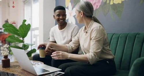 4k video footage of two coworkers working in a coffee shop