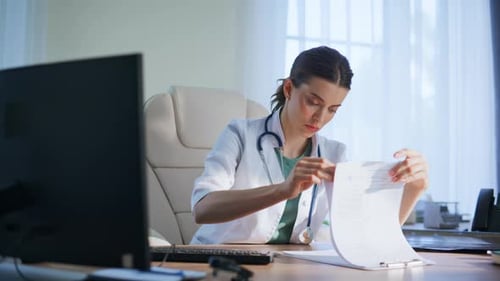 Serious Therapist Examining Diagnosis Papers Office Closeup Doctor Check Scan