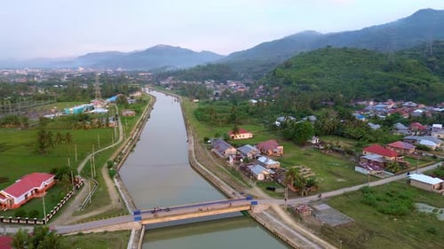 Aerial View of Canal and Village Landscape