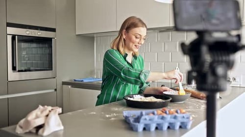 Blonde Woman Baking in Kitchen Recording Video