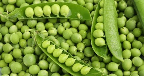 Pile of fresh green peas as background, top view