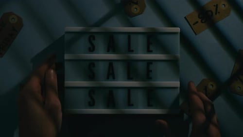 Turn on Sale Sign in a Clothing Store for Black Friday Discounts