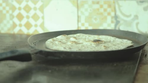 Flatbread Cooking in Pan on Stove