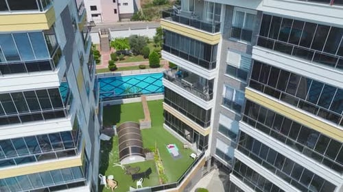 Aerial View Modern Residential Complex With a Large Pool and Water Slides for Kids By the Sea