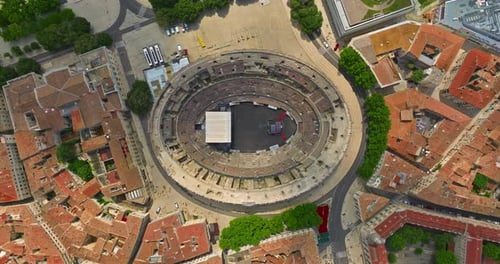 Aerial View of Famous Arena of Nimes France Old Roman Amphitheatre at Sunset