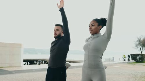 Friends Enjoying a Stretching Session Outdoors Together