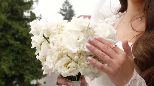 Bride Holding White Flower Bouquet on Wedding Day