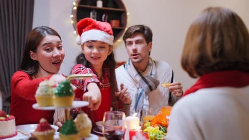 Family Holiday Meal Together at Home Indoors