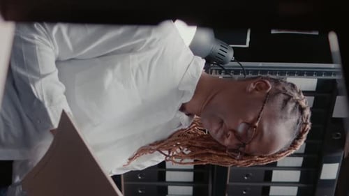 Distraught Adult Reading Documents in Office Environment