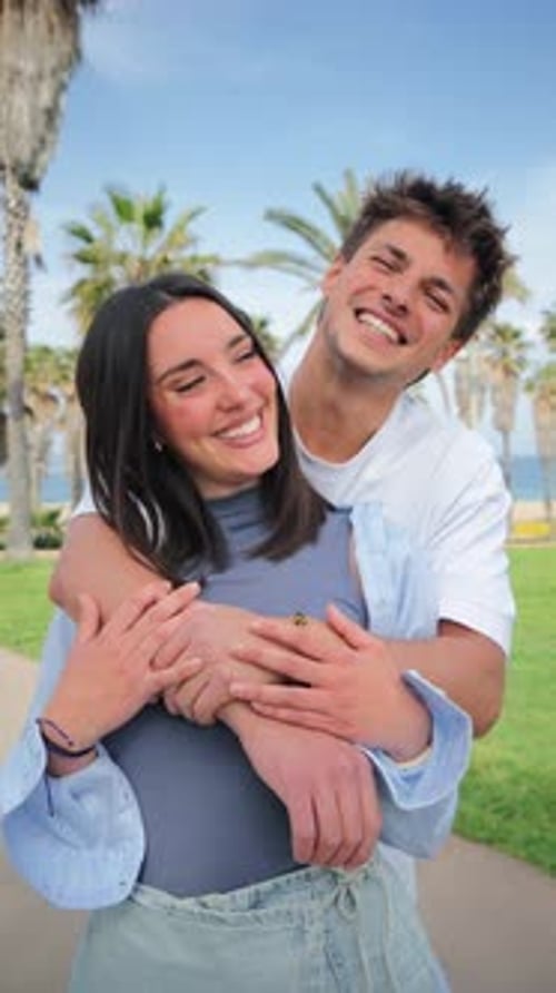 Romantic Couple Embracing in Tropical Beach Setting