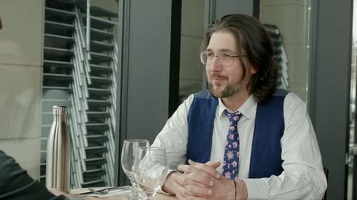 Businessmen Talking Meeting at Restaurant Table Attentive