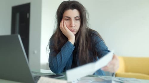 Anxious Woman Overwhelmed By Financial Problems and Unpaid Household Bills