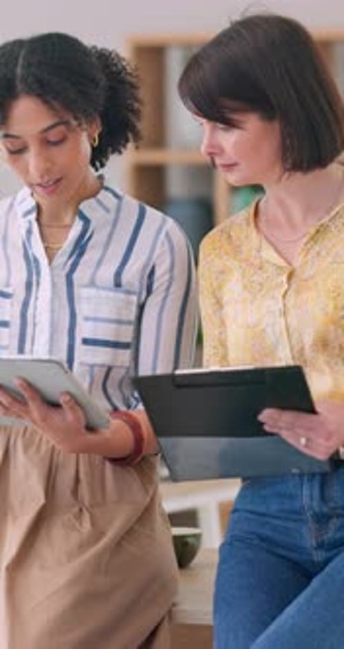 Business, women and tablet or clipboard for strategy, planning or collaboration in company office