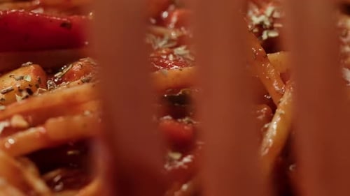 Noodles with Tomato Sauce Stirred with Fork Close-Up