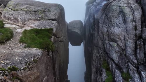 Drone Footage of Kjeragbolten Boulder in Foggy Norway