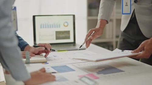 Close up of business hands are working and brainstorming on paperworks.