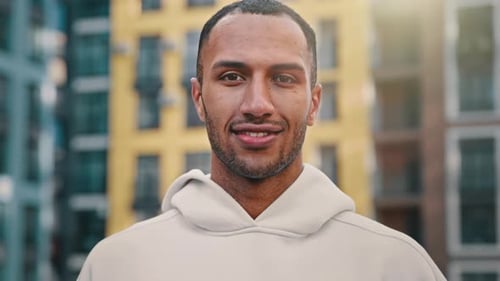 Man Smiling and Gives a Thumbs Up