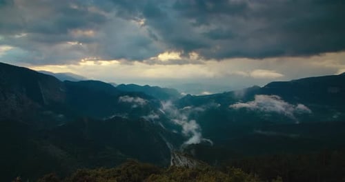 Beautiful Sunset Cloudscape Shot in Timelapse on Mountain Valley at Travel