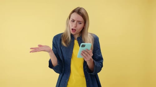 Shocked Woman Reacts to Phone Content