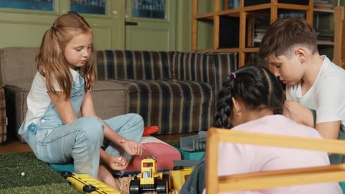 Children Play Together with Toy Cars in Indoor Setting