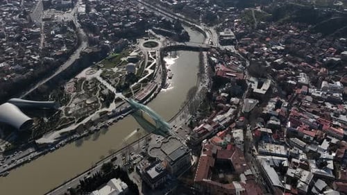 Aerial view of Tbilisi city central park and Bridge of Peace. Beautiful cityscape of Tbilisi