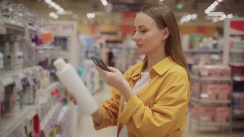 Choosing the Perfect Shampoo While Shopping in a Store for Hair Care Products