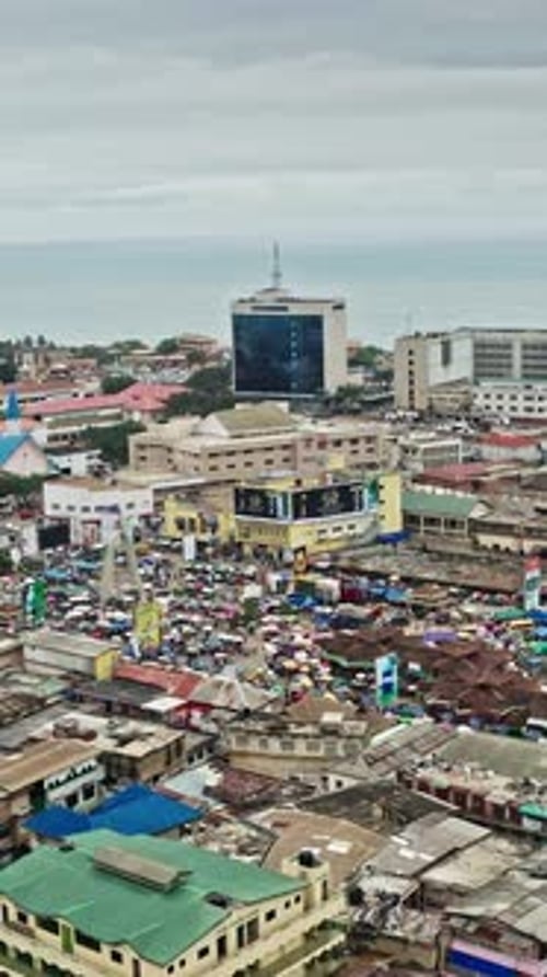 Aerial view of urban life in Accra, Ghana under cloudy skies