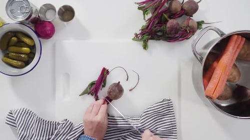 Flat Lay Step By Step Cutting Cookies Vegetables on a White Cutting Board for Vinaigrette Salad